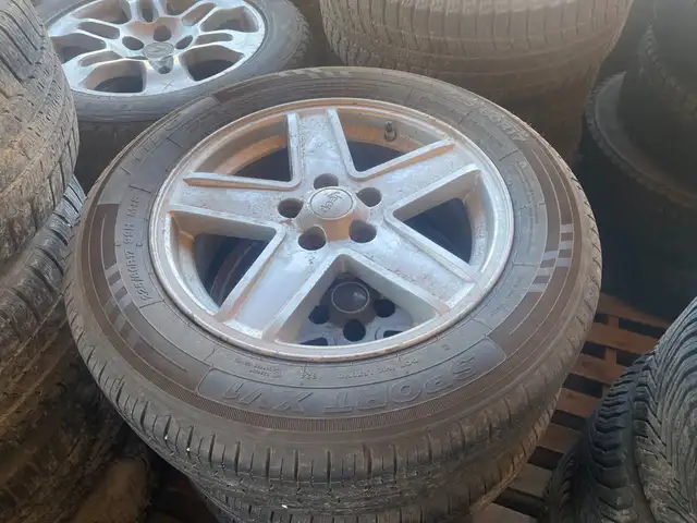 225/60R17 Hilo Sport XV1 All-Season Tires on Aluminum Wheels